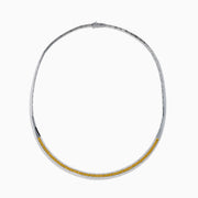 The Canare 14K Two Tone Gold White and Yellow Diamond Necklace features a sleek, curved design accented with a row of sparkling yellow diamonds bordered by slim gold edges.