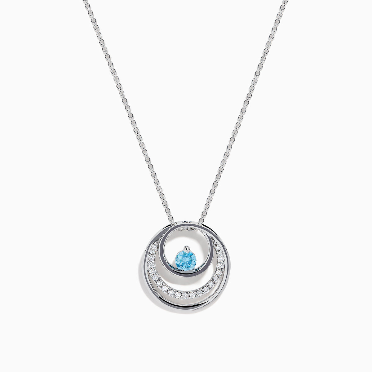 The Lab Grown Blue and White Diamond Circle Pendant in 14K White Gold features a circular pendant with clear and blue stones, displayed on a plain white background.