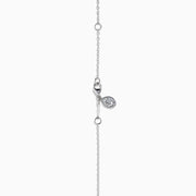 The Lab Grown Heart and Round Diamond Halo Pendant in 14K White Gold features a sparkling heart-shaped lab grown diamond with a halo of smaller diamonds on a delicate silver chain, shown against a plain white background.