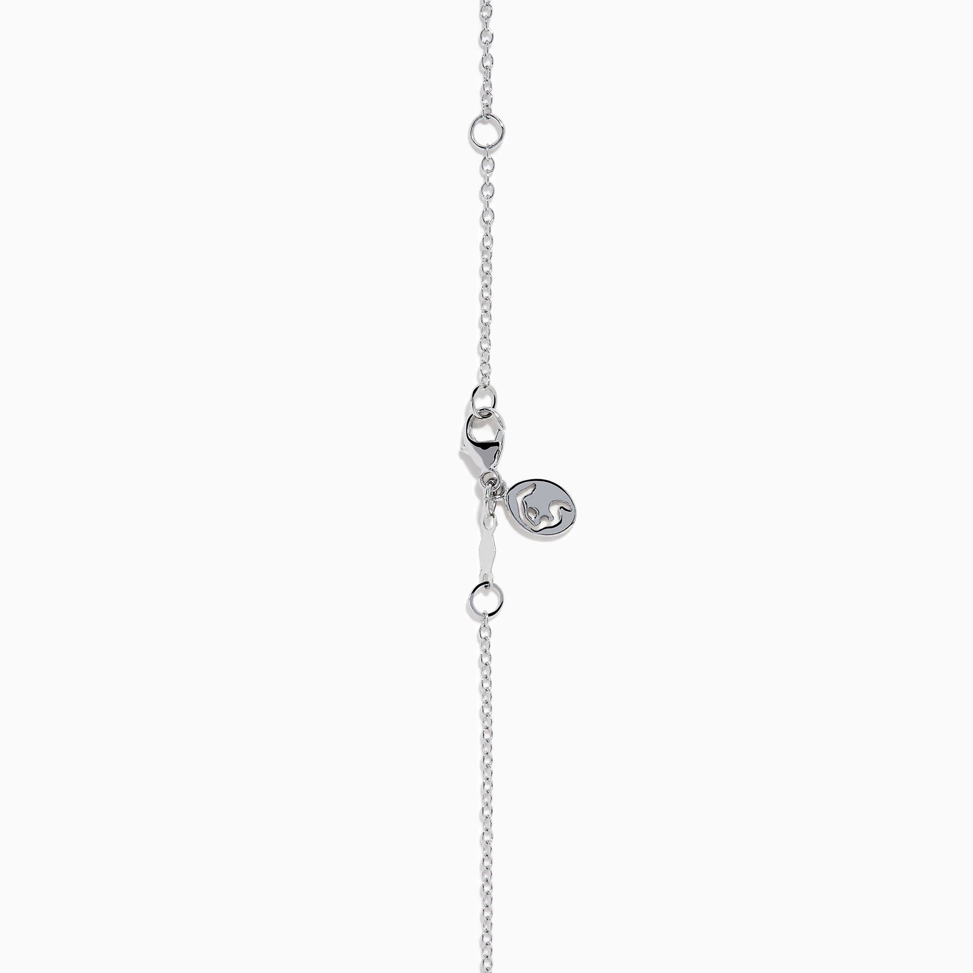 The Lab Grown Heart and Round Diamond Halo Pendant in 14K White Gold features a sparkling heart-shaped lab grown diamond with a halo of smaller diamonds on a delicate silver chain, shown against a plain white background.