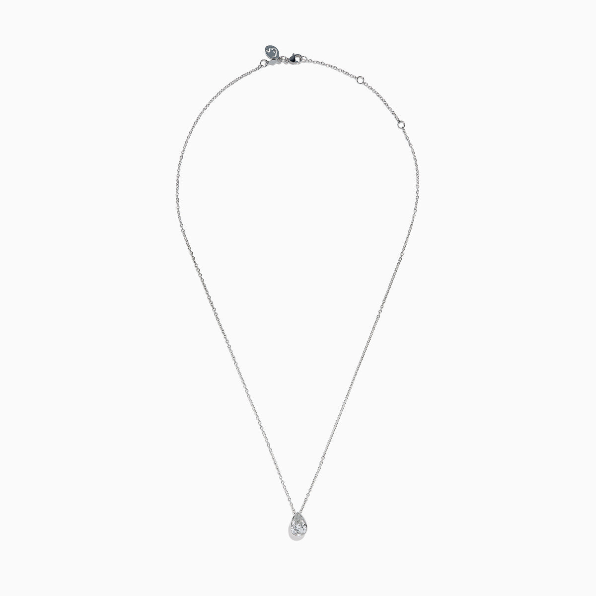 The Lab Grown Pear Diamond Bezel Pendant in 14K White Gold features a delicate silver chain and a pear-shaped lab grown diamond in an elegant bezel setting, showcased against a white background.