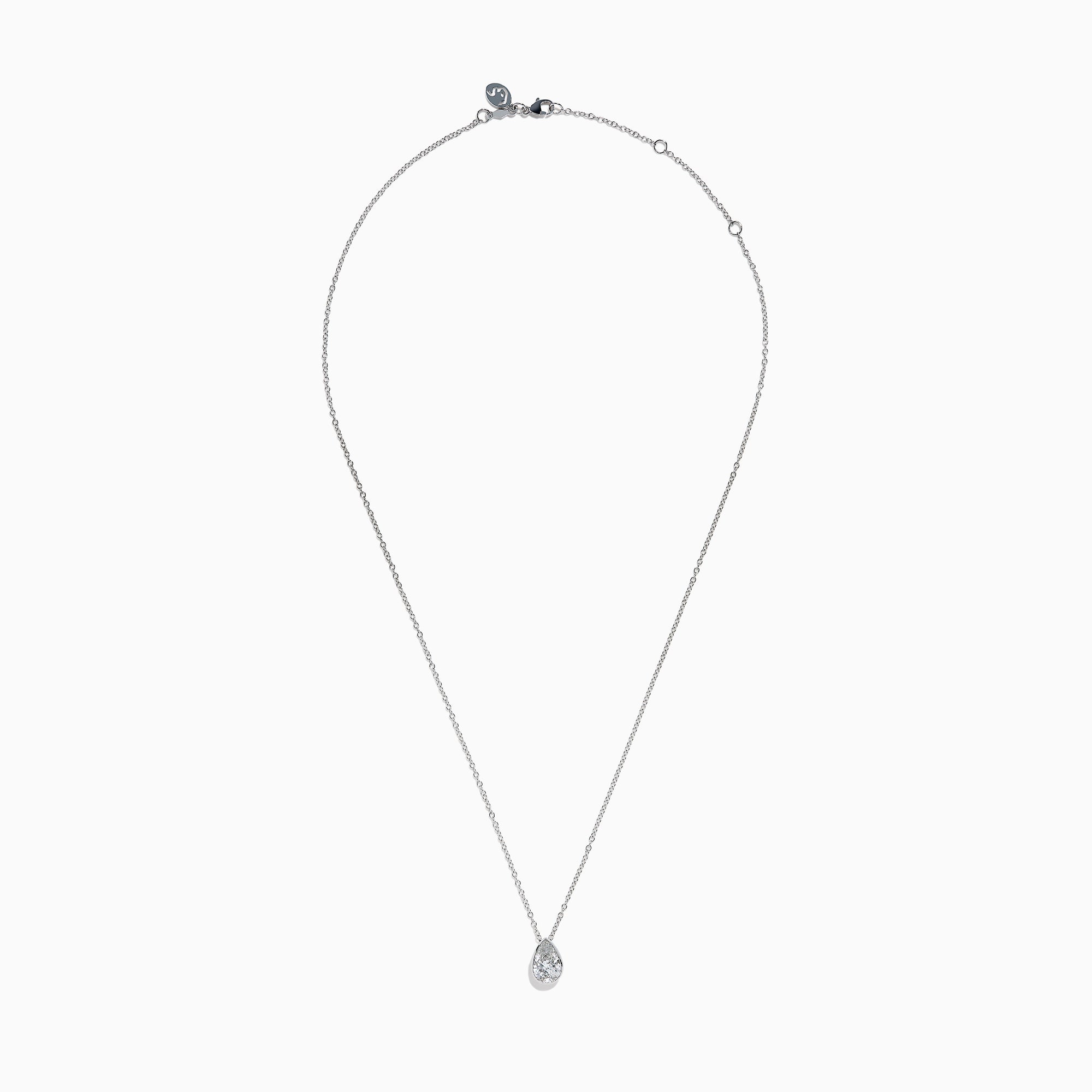 The Lab Grown Pear Diamond Bezel Pendant in 14K White Gold features a delicate silver chain and a pear-shaped lab grown diamond in an elegant bezel setting, showcased against a white background.
