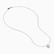 The Lab Grown Pear Diamond Bezel Pendant in 14K White Gold features a delicate silver chain and a pear-shaped lab grown diamond in an elegant bezel setting, showcased against a white background.