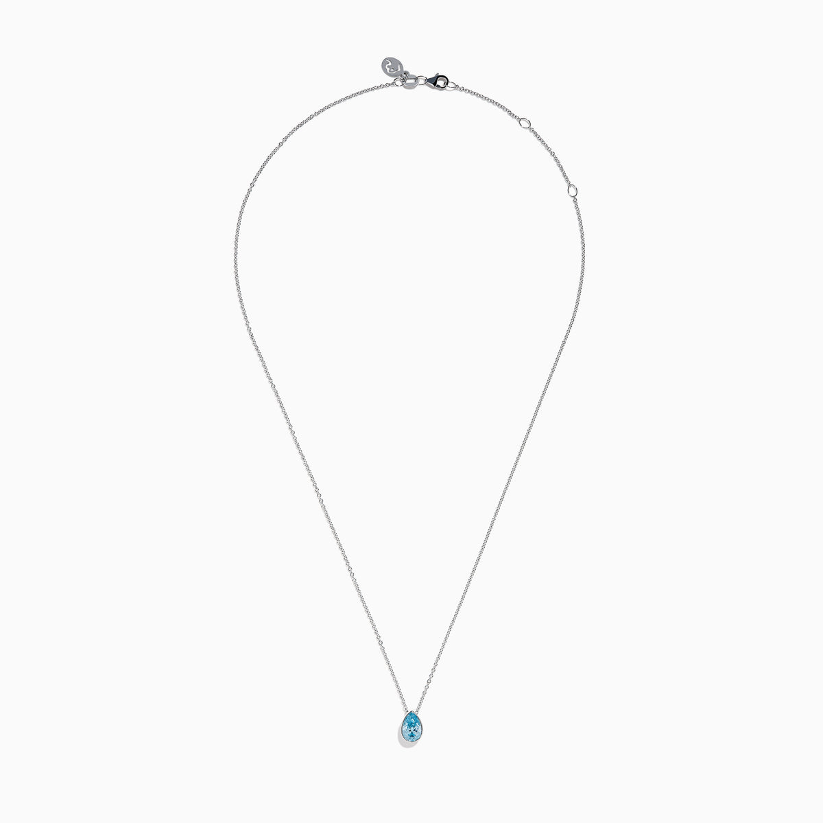 The Lab Grown Pear Solitaire Blue Diamond Collarbone Necklace in 14K White Gold features a minimalist bezel-set, teardrop-shaped blue diamond pendant on a fine white gold chain, elegantly displayed against a white background.