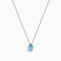 The Lab Grown Pear Solitaire Blue Diamond Collarbone Necklace in 14K White Gold features a minimalist bezel-set, teardrop-shaped blue diamond pendant on a fine white gold chain, elegantly displayed against a white background.