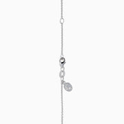 The Lab Grown Pear Solitaire Blue Diamond Collarbone Necklace in 14K White Gold features a minimalist bezel-set, teardrop-shaped blue diamond pendant on a fine white gold chain, elegantly displayed against a white background.