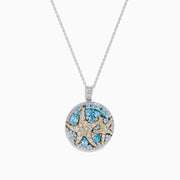 A Lab Grown Blue and White Diamond Starfish Pendant in 14K Two Tone Gold, featuring a round starfish design accented with blue gemstones and lab grown diamonds.