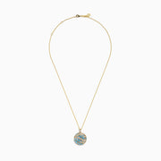 The Lab Grown Blue and White Diamond Coin Pendant in 14K Yellow Gold features a round design with blue and white diamonds plus clear stones, elegantly arranged in a wavy pattern on a white background.