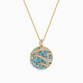 The Lab Grown Blue and White Diamond Coin Pendant in 14K Yellow Gold features a round design with blue and white diamonds plus clear stones, elegantly arranged in a wavy pattern on a white background.