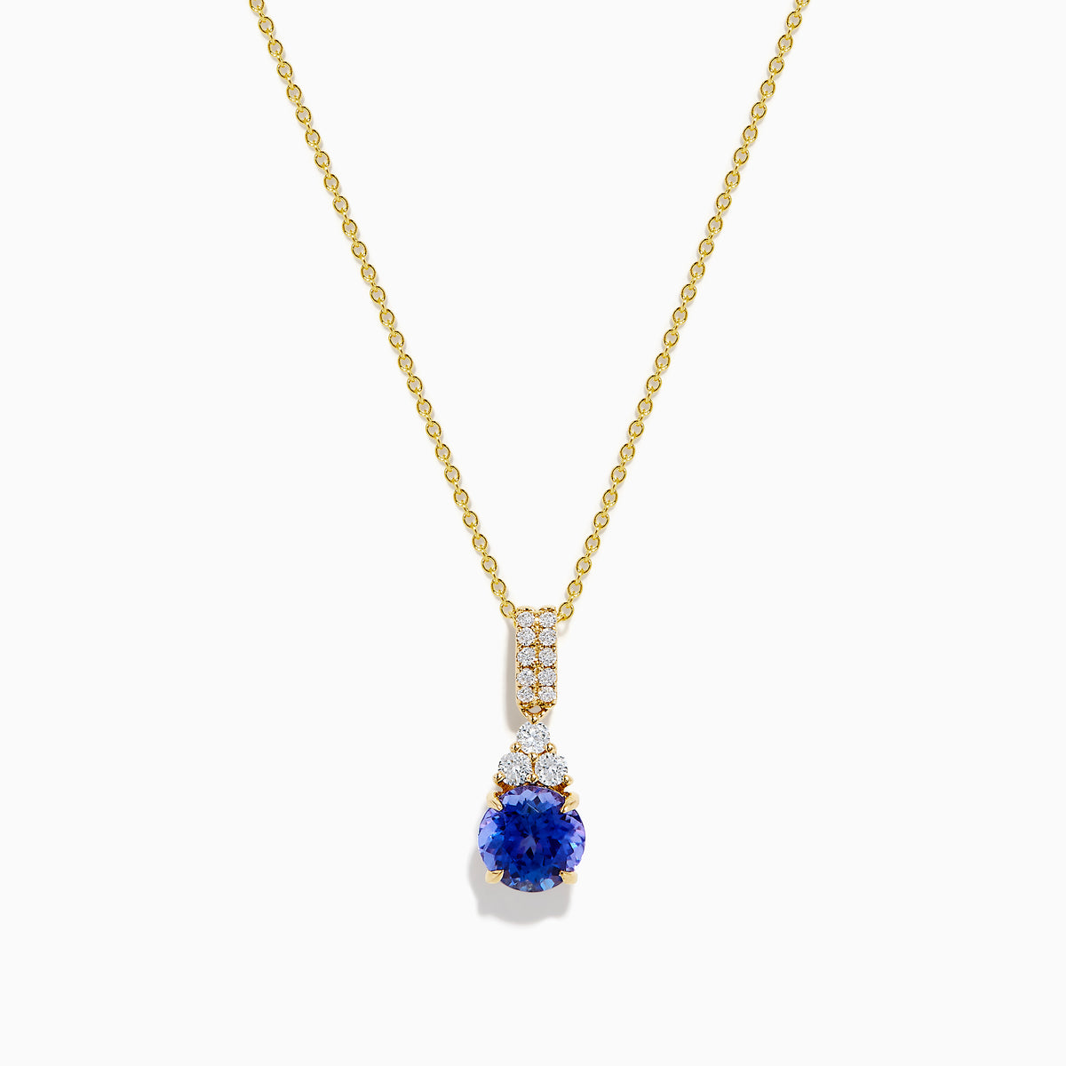 The Nahla 14K Yellow Gold Tanzanite and Diamond Pendant features a round blue tanzanite and white diamonds, set on a yellow gold chain and shown on a white background.