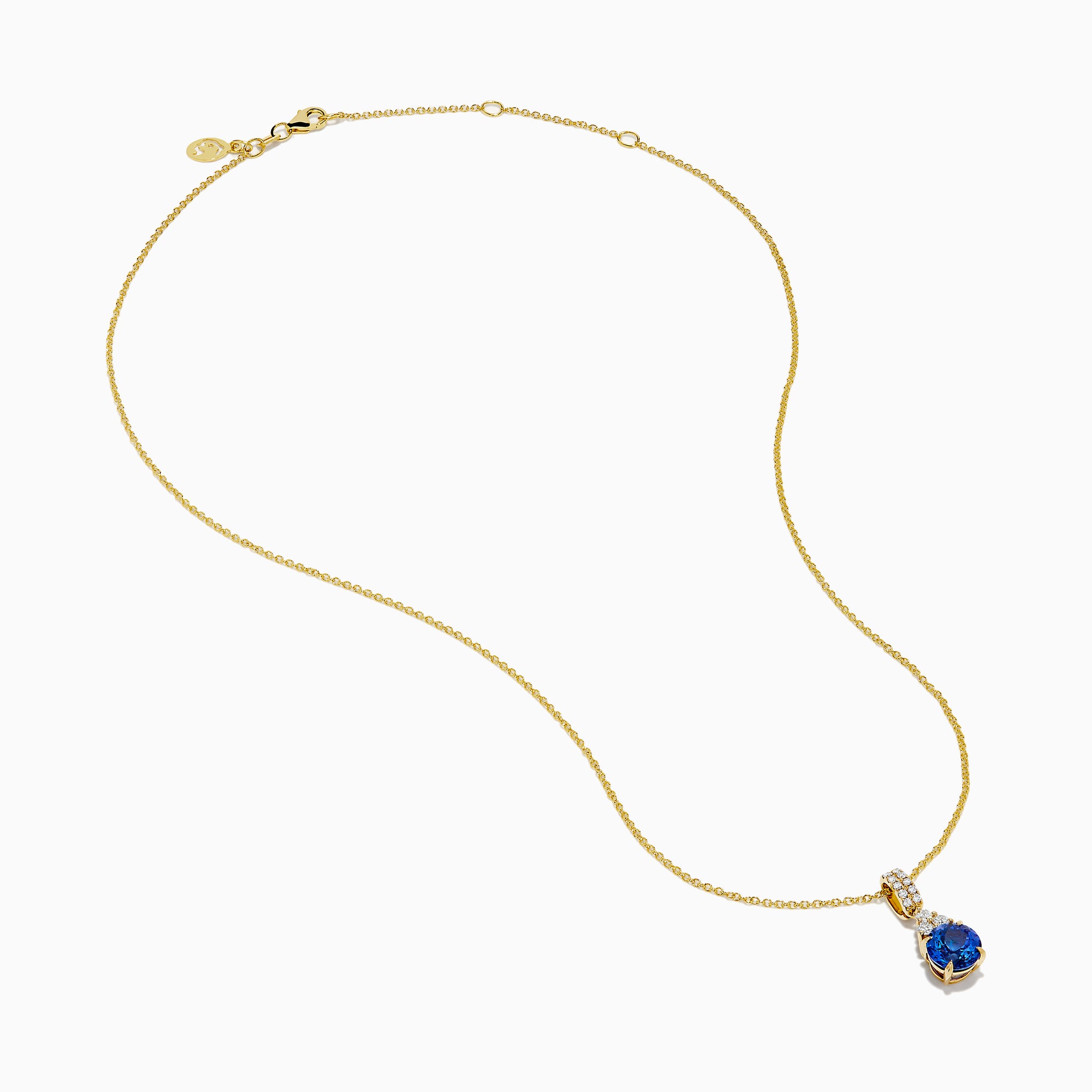 The Nahla 14K Yellow Gold Tanzanite and Diamond Pendant features a round blue tanzanite and white diamonds, set on a yellow gold chain and shown on a white background.