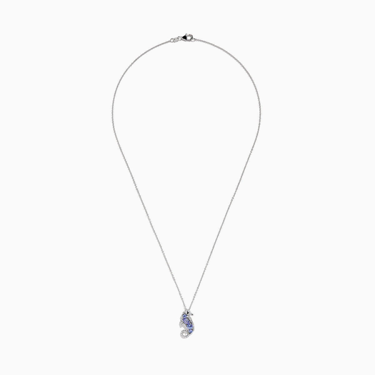 The Seaside 925 Sterling Silver Tanzanite and Diamond Seahorse Pendant features a sparkling seahorse design with tanzanite and diamond accents, hanging from a delicate chain on a white background.