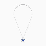 The 925 Silver Tanzanite and Diamond Starfish Pendant features a sparkling starfish design, adorned with tanzanite and diamonds, displayed against a white background.