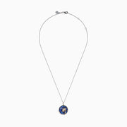 The Nahla 925 Sterling Silver and 14K Yellow Gold Tanzanite & Diamond Palm Tree Pendant features tanzanite gemstones, sparkling diamonds, and a gold palm tree design on a round pendant.
