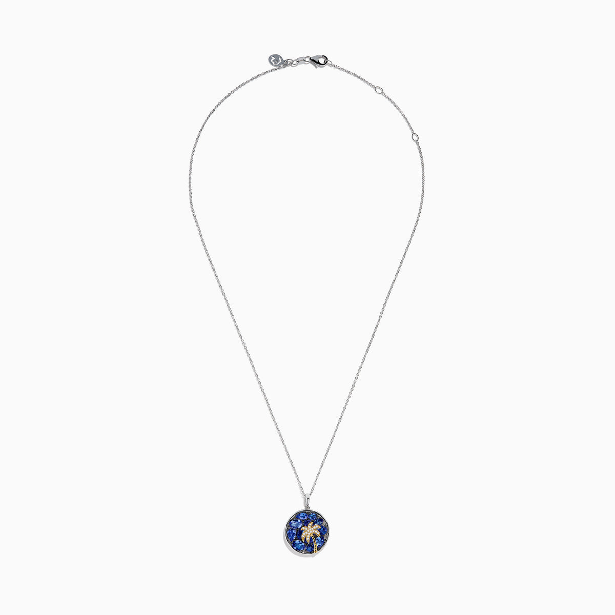 The Nahla 925 Sterling Silver and 14K Yellow Gold Tanzanite & Diamond Palm Tree Pendant features tanzanite gemstones, sparkling diamonds, and a gold palm tree design on a round pendant.