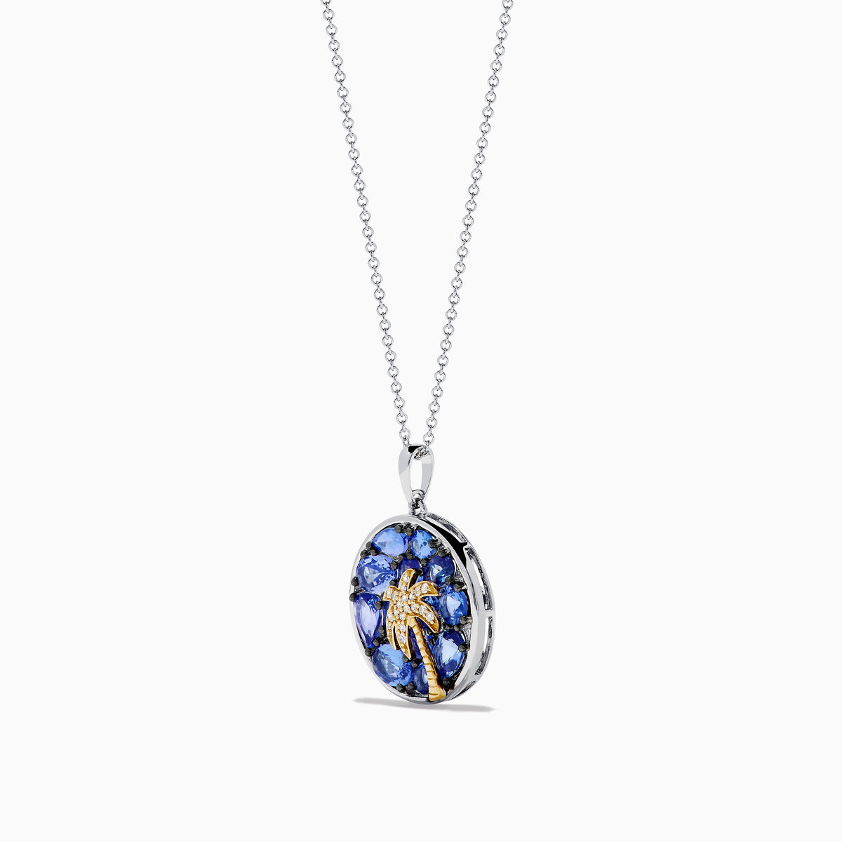 The Nahla 925 Sterling Silver and 14K Yellow Gold Tanzanite & Diamond Palm Tree Pendant features tanzanite gemstones, sparkling diamonds, and a gold palm tree design on a round pendant.