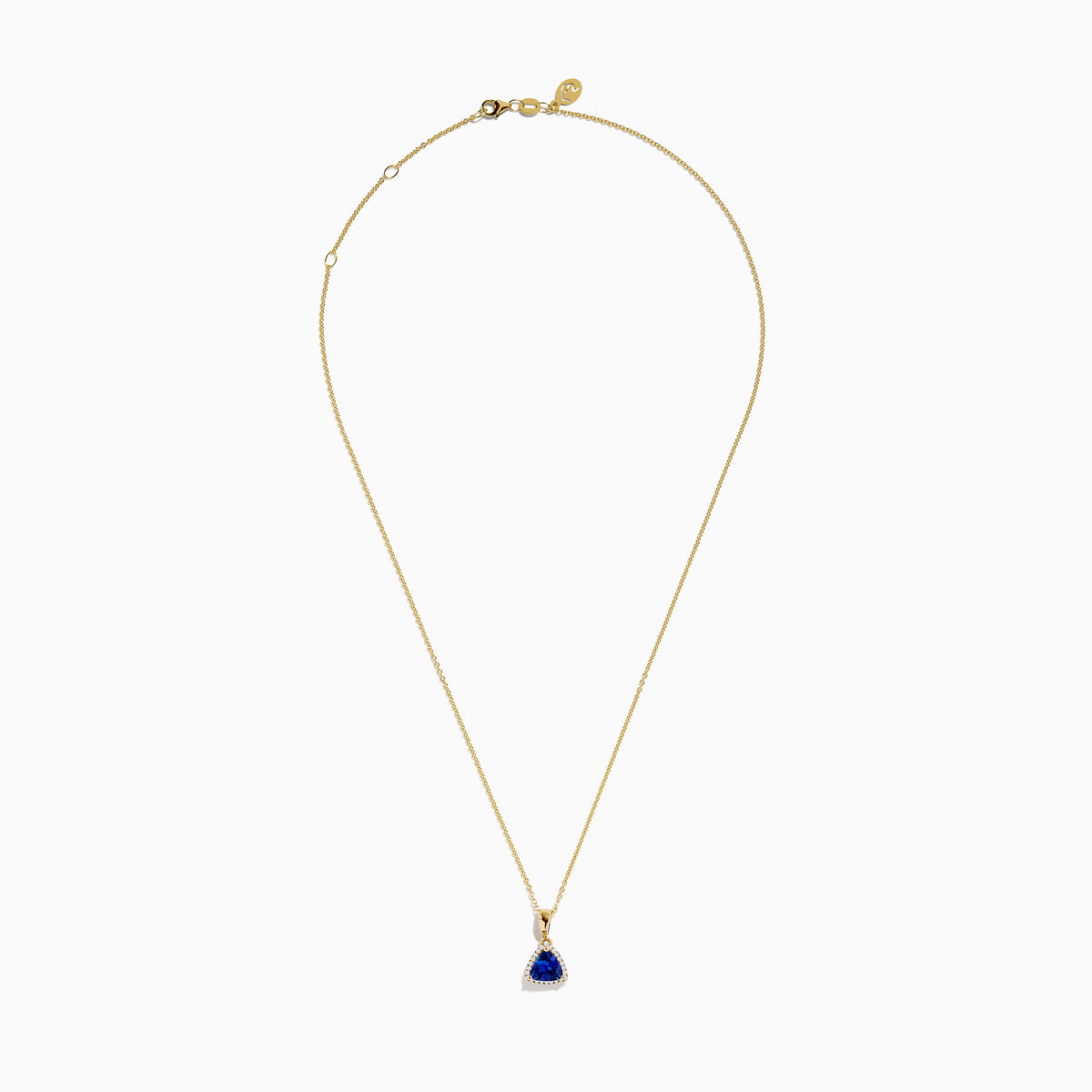 The Nahla Siri 14K Yellow Gold Tanzanite and Diamond Pendant features a triangular tanzanite accented by sparkling diamonds, set on a delicate gold chain against a white background.