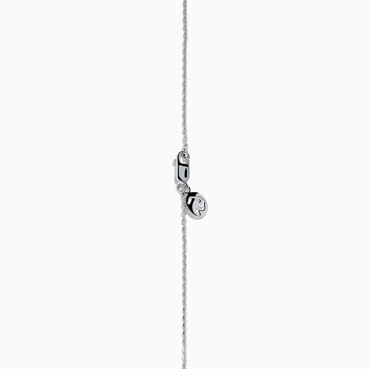 The 14K White Gold Black and White Diamond Halo Pendant showcases an oval black gemstone encircled by sparkling white diamonds, creating a striking contrast against a white background.