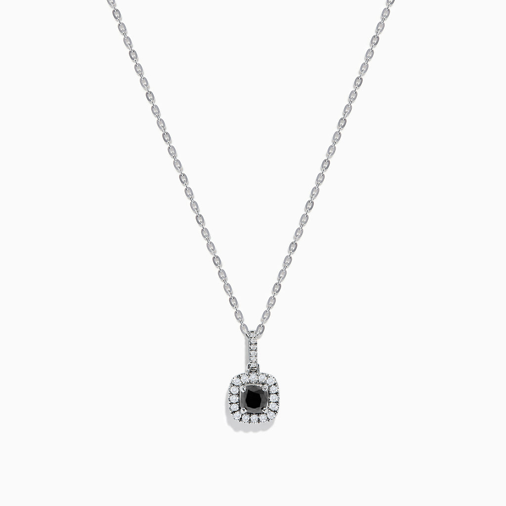 The 14K White Gold Black and White Diamond Halo Pendant features a central black diamond encircled by a halo of white diamonds, shown against a plain white background.