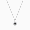 The 14K White Gold Black and White Diamond Halo Pendant features a central black diamond encircled by a halo of white diamonds, shown against a plain white background.