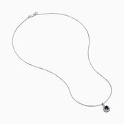 The 14K White Gold Black and White Diamond Halo Pendant features a central black diamond encircled by a halo of white diamonds, shown against a plain white background.