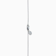 The 14K White Gold Black and White Diamond Halo Pendant features a central black diamond encircled by a halo of white diamonds, shown against a plain white background.