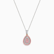 The 14K Two Tone Gold Pink and White Diamond Pendant features a teardrop design with concentric pink and white diamonds, accented by three white stones linking the pendant to the chain.