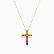 The Watercolors 14K Yellow Gold Multi Sapphire Cross Pendant features a yellow gold chain and a cross pendant adorned with multi sapphire gemstones in a gradient pattern, displayed on a plain white background.