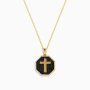 The 14K Yellow Gold Black Diamond Cross Pendant features an octagonal black diamond cross set in 14K yellow gold, shown against a white background.