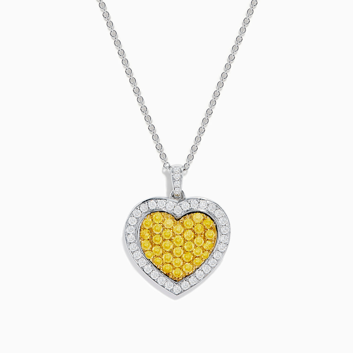 The 18K Two Tone Gold White and Yellow Diamond Heart Cluster Pendant features a heart shape bordered with white diamonds and a center of yellow diamonds, creating a vibrant, elegant design.