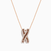 The 14K Rose Gold Brown and White Diamond Pendant features an “X”-shaped design with intertwined rows of brown and white diamonds, suspended from a delicate chain.