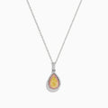 An 18K three tone gold necklace with a pear-shaped yellow diamond pendant, accented by a pink diamond halo.