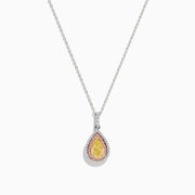 An 18K three tone gold necklace with a pear-shaped yellow diamond pendant, accented by a pink diamond halo.
