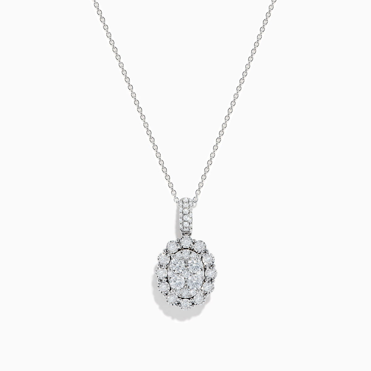 The Bouquet 14K White Gold Oval Diamond Pendant showcases an oval diamond encrusted with sparkling stones and a halo of round diamonds, elegantly displayed on a plain white background.