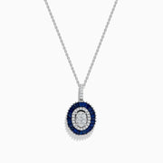 The Royal Bleu 14K White Gold Sapphire and Diamond Pendant features an oval diamond cluster surrounded by sapphires and an outer row of sparkling diamonds.