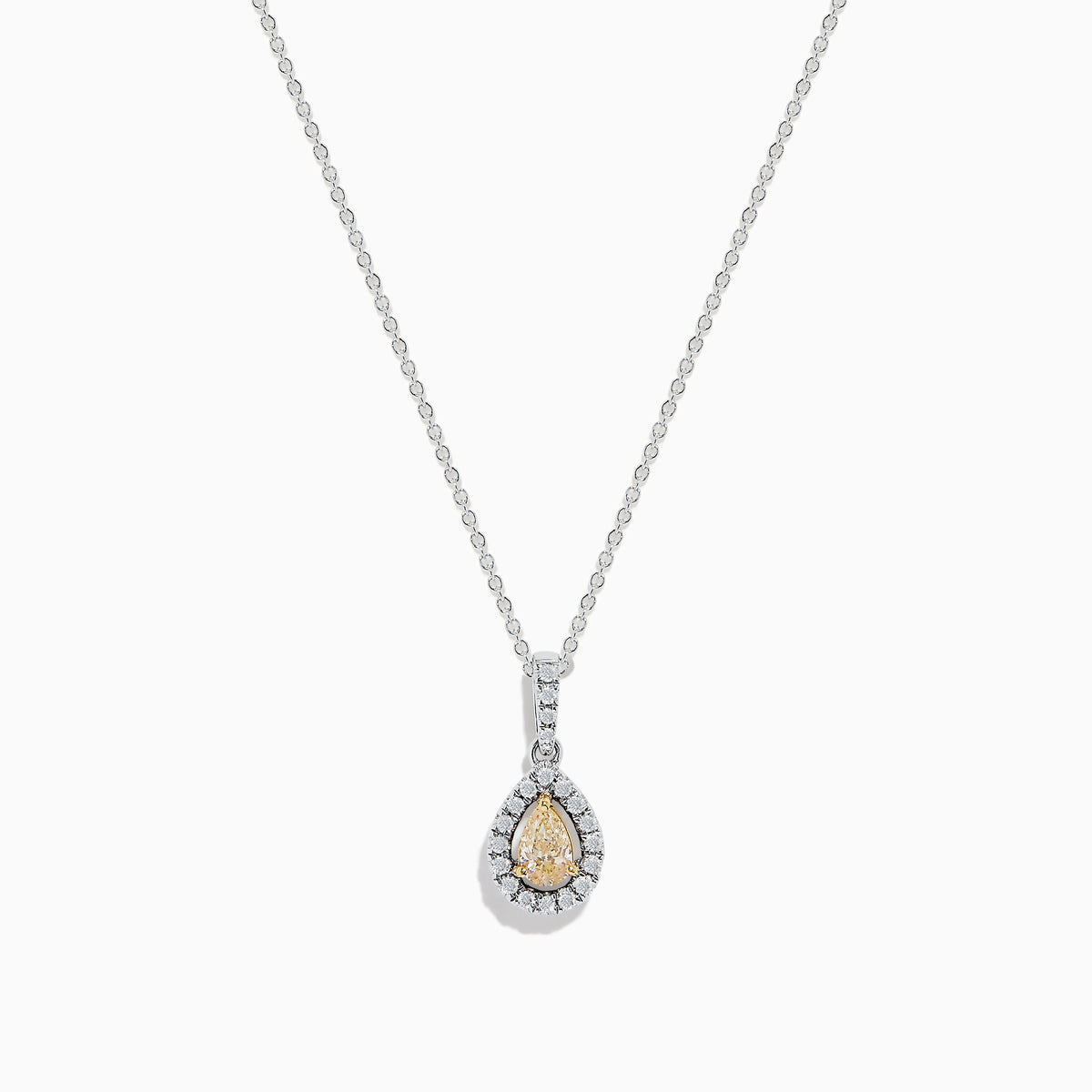 The Canare 18K Two-Tone Gold Teardrop Pendant features a yellow diamond, white diamonds, and a single clear stone above, all elegantly set and hanging from a fine chain.