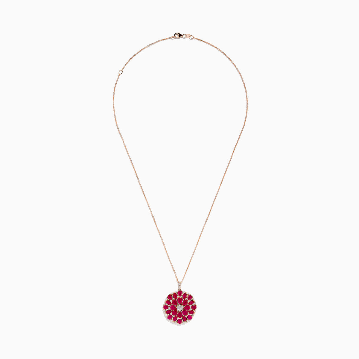The Ruby Royale 14K Rose Gold Ruby and Diamond Flower Pendant features a round floral design with rubies and diamond accents at the center and edges.