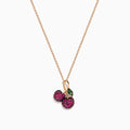 The 14K Rose Gold Ruby and Tsavorite Pavé Double Cherries Pendant features two round ruby pavé cherries and a sparkling tsavorite leaf accent on a delicate rose gold necklace.