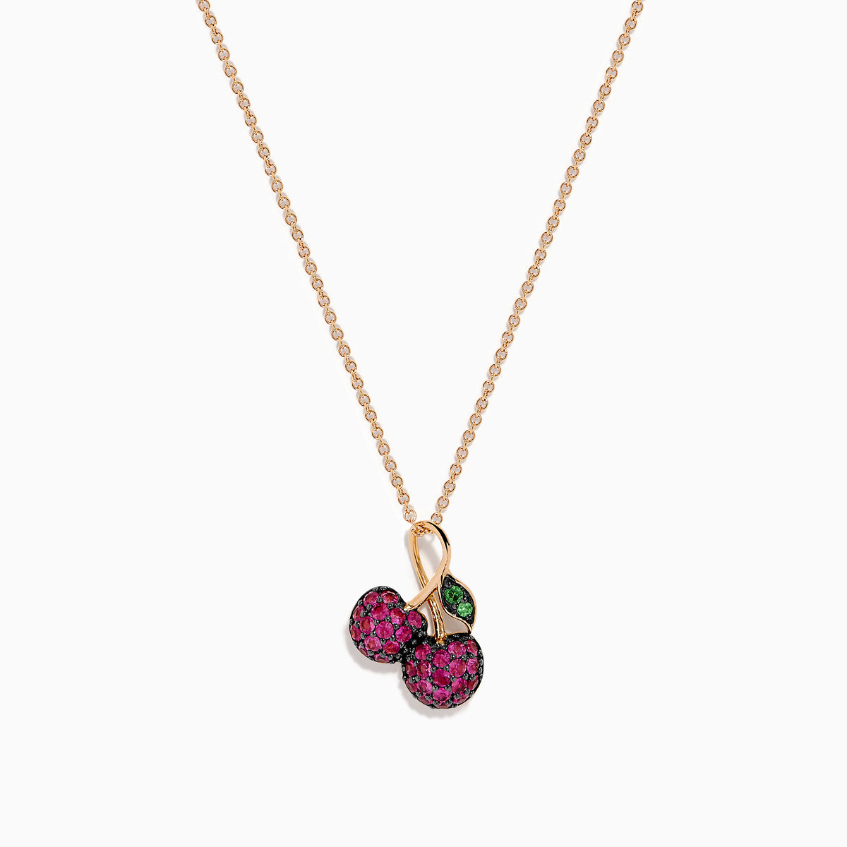 The 14K Rose Gold Ruby and Tsavorite Pavé Double Cherries Pendant features two round ruby pavé cherries and a sparkling tsavorite leaf accent on a delicate rose gold necklace.
