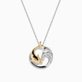 The Seaside 14K Two-Tone Gold Diamond Dolphin Pendant features a circular design with a gold dolphin, silver wave, sparkling diamonds, and hangs from a delicate silver chain displayed on a white background.
