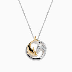 The Seaside 14K Two-Tone Gold Diamond Dolphin Pendant features a circular design with a gold dolphin, silver wave, sparkling diamonds, and hangs from a delicate silver chain displayed on a white background.