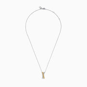 The 14K Two Tone Gold White and Yellow Diamond Criss Cross Pendant features an elegant X design with intersecting bars of white and yellow diamonds.