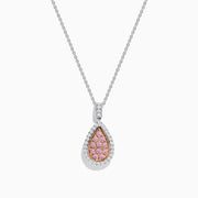 A 14K two tone gold pendant with a teardrop-shaped design, featuring pink and white diamonds at the center and surrounded by clear stones, hanging on a silver chain necklace.