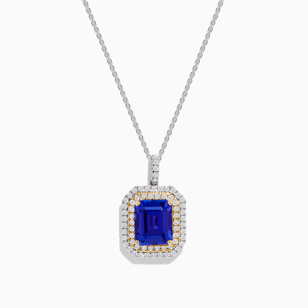 The Nahla 14K White & Yellow Gold Tanzanite and Diamond Pendant showcases a large emerald-cut blue tanzanite framed by a double halo of diamonds and yellow stones, elegantly hanging from a delicate chain.