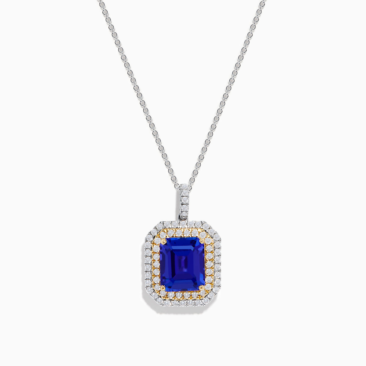 The Nahla 14K White & Yellow Gold Tanzanite and Diamond Pendant showcases a large emerald-cut blue tanzanite framed by a double halo of diamonds and yellow stones, elegantly hanging from a delicate chain.