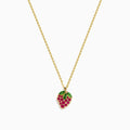 The Novelty 14K Yellow Gold Ruby and Tsavorite Strawberry Pendant features red rubies and green tsavorites on a chain necklace, capturing a strawberry’s shape and leafy top against a plain white background.