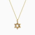 The 14K Yellow Gold Diamond Star of David Pendant features a shining diamond centerpiece and sparkling gemstones along the edges, set on a classic gold chain.