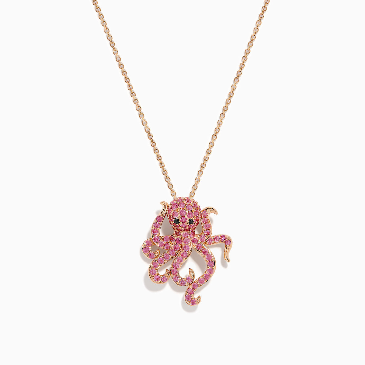 The 14K Rose Gold Pink Sapphire and Black Diamond Pavé Octopus Pendant features a body and tentacles adorned with pink sapphires, shown against a white background.