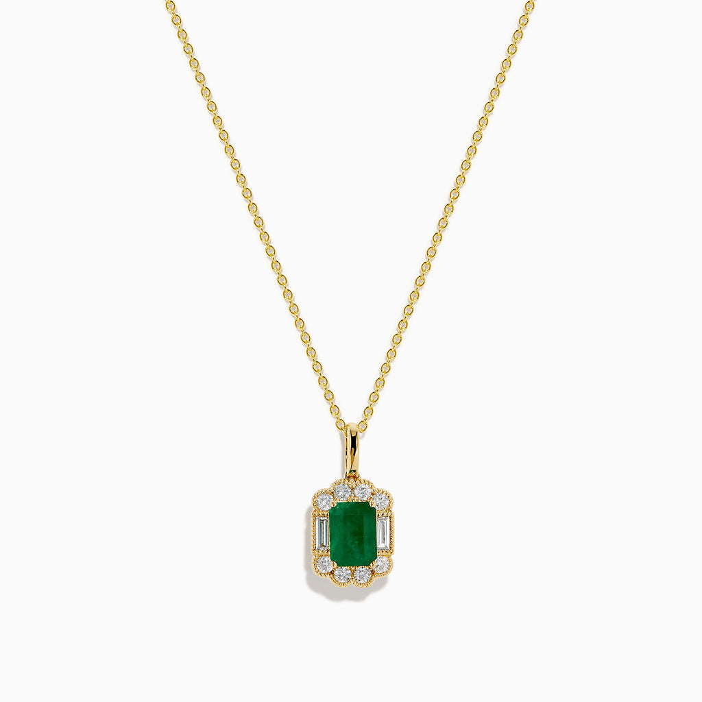 The 14K Yellow Gold Emerald and Diamond Halo Pendant features a rectangular green emerald, surrounded by round and baguette diamonds in a halo setting, all centrally suspended from a delicate gold chain.