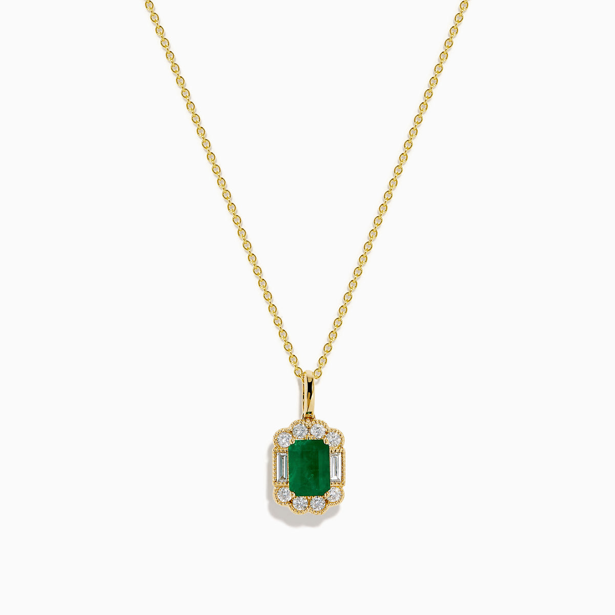 The 14K Yellow Gold Emerald and Diamond Halo Pendant features a rectangular green emerald, surrounded by round and baguette diamonds in a halo setting, all centrally suspended from a delicate gold chain.